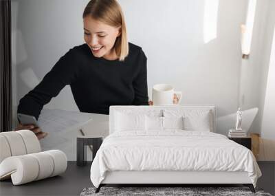 Business woman in office indoors work with phone Wall mural