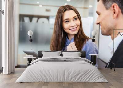 Business woman talking to her client and using tablet Wall mural