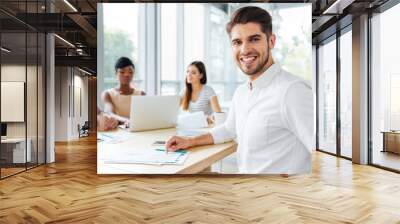 Businessman working with colleagues in office Wall mural