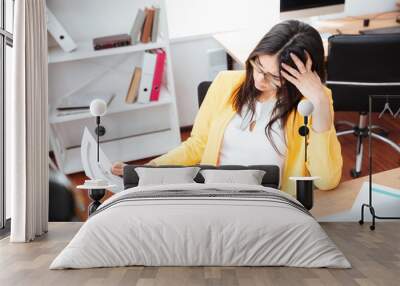 businesswoman analysing graphics on paper Wall mural