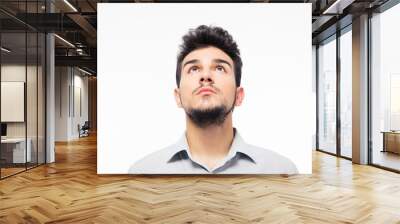 Casual man looking up at copyspace Wall mural