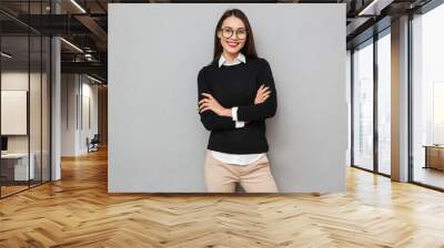 Cheerful asian woman in business clothes and eyeglasses Wall mural