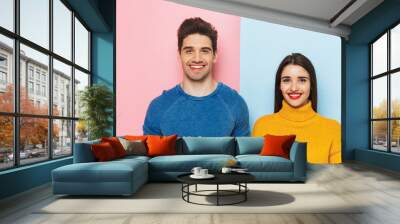 Cheerful young couple standing Wall mural