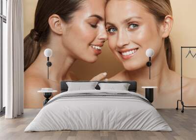 Cheery beautiful blonde and brunette women Wall mural