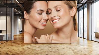 cheery beautiful blonde and brunette women Wall mural