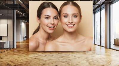 cheery beautiful blonde and brunette women Wall mural