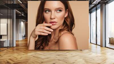 Close-up Beauty portrait of mystery ginger woman with long hair Wall mural