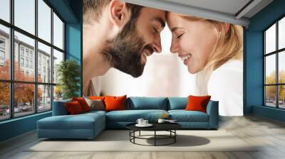 Close up of a beautiful happy young couple relaxing Wall mural