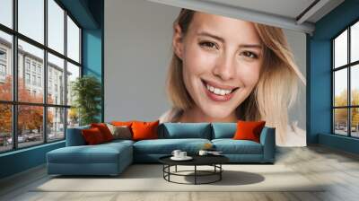 Close up of a lovely young blonde short haired woman Wall mural