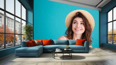 Close up portrait of a smiley young girl in straw hat Wall mural