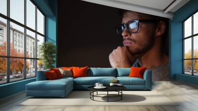 closeup of focused man in glasses looking at screen Wall mural