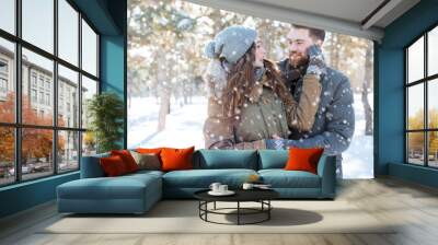 Couple looking at each other in winter park Wall mural