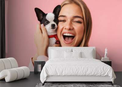 Cute lovely girl playing with her pet chihuahua Wall mural