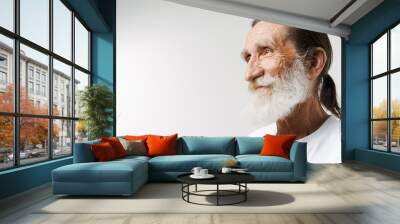 European senior man with beard smiling and looking aside Wall mural