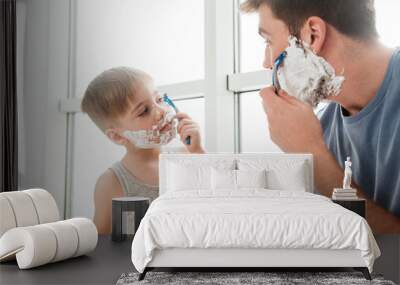 Father and son are shaving in bathroom Wall mural