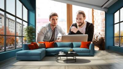 Front view of Friends with laptop in cafe Wall mural