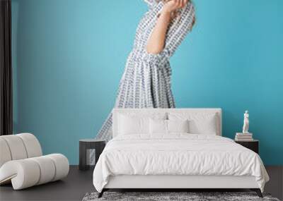 Full length image of Pleased blonde woman in dress dancing Wall mural