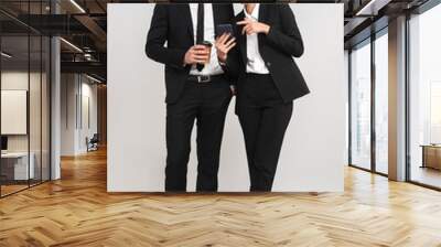 Full length of confident young business couple Wall mural