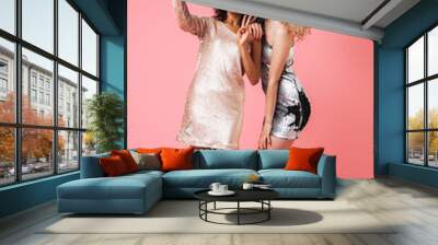 Full length of two beautiful smiling women in shiny dresses Wall mural