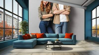 Full length portrait of a happy young couple standing Wall mural