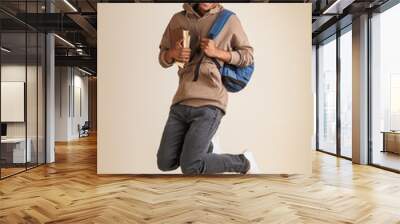 Full length portrait of a smiling young afro american man Wall mural