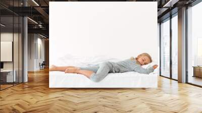 Full length portrait of sleeping peaceful girl in gray pajamas lying in bed Wall mural