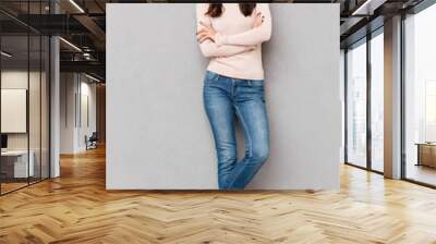 full-length shot of caucasian smiling woman with red lips makeup standing with arms crossed over gra Wall mural