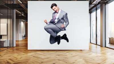 funny businessman jumping in air Wall mural