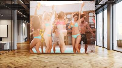 Group of best friends having fun dancing at swimming pool Wall mural