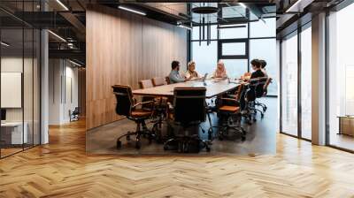 Group of colleagues having discussion during meeting in conference room Wall mural