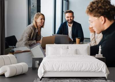 Group of smart motivated businesspeople working together Wall mural