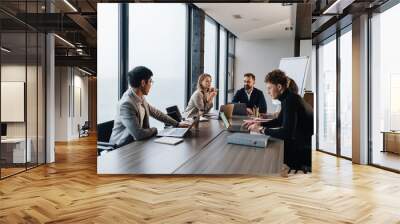 Group of smart motivated businesspeople working together Wall mural