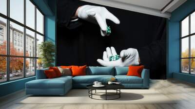 Hands of man magician in white gloves holding casino chips Wall mural