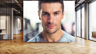 Handsome man at gym Wall mural