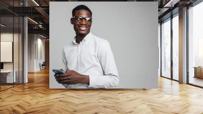 Handsome smiling young african busines man Wall mural