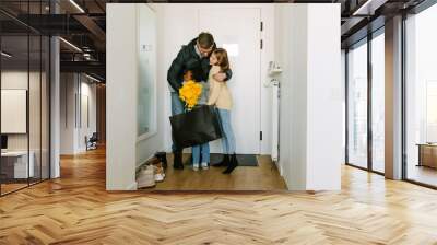 Happy adoptive sisters meeting their father who came home Wall mural