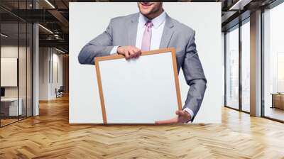 Happy businessman holding blank board Wall mural