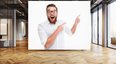 Happy excited bearded man in eyeglasses Wall mural