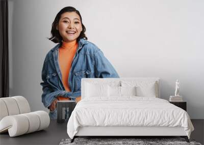 Happy smiling young asian brunette woman Wall mural