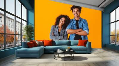 Happy young african couple wearing casual clothes Wall mural