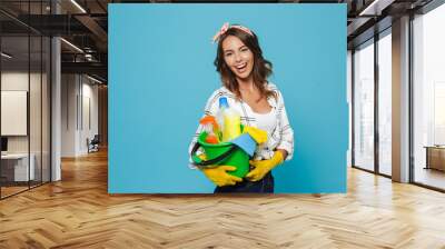 image of attractive woman 20s wearing yellow rubber gloves for hands protection holding bucket with  Wall mural