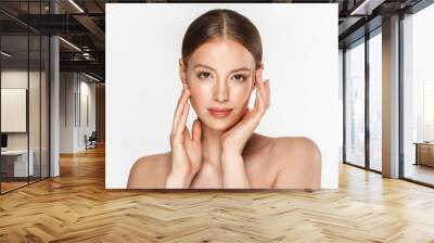 Image of charming half-naked woman looking at camera and touching her face Wall mural