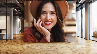 Image of happy elegant adult woman smiling while sitting in street cafe Wall mural