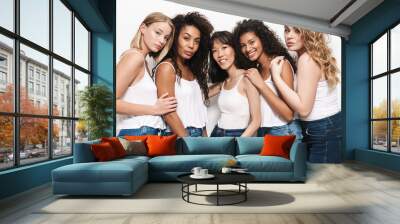 Image of pretty multinational women posing and hugging together Wall mural