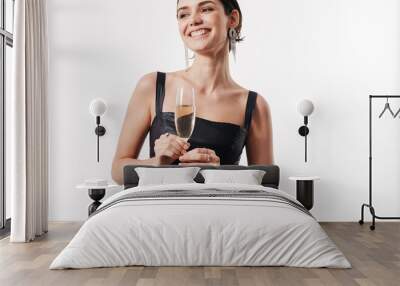 Image of young happy woman smiling and holding glass of champagne Wall mural