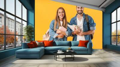 Image of young students smiling while holding exercise books Wall mural