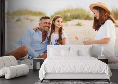 Joyful family with father, mother, daughter Wall mural