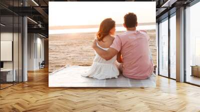 Lovely young couple wearing summer clothing Wall mural