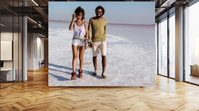 Loving young african couple walking Wall mural