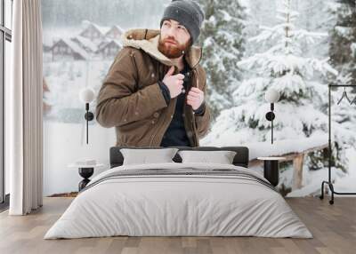 Man standing outdoors in winter Wall mural